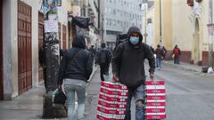 LIMA, PERU - AUGUST 28: A worker carries boxes on August 28, 2020 in Lima, Peru. According to the INEI (National Institute of Statistics and Informatics), Peru&#039;s economy severely contracted between April and June when strict confinement measures were implemented to stop spread of coronavirus. The country&#039;s GDP fell 30.2% in comparison to the same period last year, suffering the largest slump registered. (Photo by Raul Sifuentes/Getty Images)