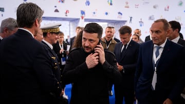 Ukraine's President Volodymyr Zelensky speaks on the phone ahead of a meeting at the 6th European Political Community summit, at Skanderbeg Square in Tirana, Albania, on May 16, 2025. Leon Neal/Pool via REUTERS