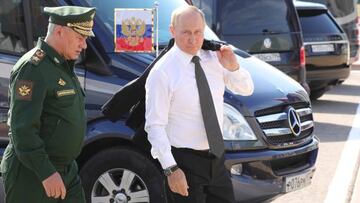 Russian President Vladimir Putin (R) and Defence Minister Sergei Shoigu arrive for the opening ceremony of the Army-2022 International Military-Technical Forum and the International Army Games 2022 at the Russian Armed Forces' Patriot Park in Kubinka, outside Moscow on August 15, 2022. (Photo by Mikhail Klimentyev / Sputnik / AFP) (Photo by MIKHAIL KLIMENTYEV/Sputnik/AFP via Getty Images)