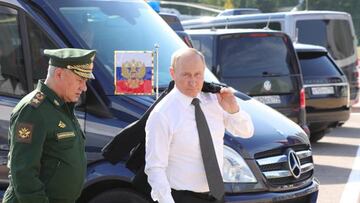 Russian President Vladimir Putin (R) and Defence Minister Sergei Shoigu arrive for the opening ceremony of the Army-2022 International Military-Technical Forum and the International Army Games 2022 at the Russian Armed Forces' Patriot Park in Kubinka, outside Moscow on August 15, 2022. (Photo by Mikhail Klimentyev / Sputnik / AFP) (Photo by MIKHAIL KLIMENTYEV/Sputnik/AFP via Getty Images)