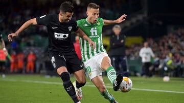 Elche's Spanish defender Antonio Barragan (L) vies with Real Betis' Spanish midfielder Sergio Canales during the Spanish League football match between Real Betis and Elche CF at the Benito Villamarin stadium in Seville on April 19, 2022. (Photo