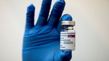 FILE PHOTO: A medical worker holds a bottle of AstraZeneca's COVID-19 vaccine at a vaccination centre in Kuala Lumpur, Malaysia May 5, 2021 in this file photo. REUTERS/Lim Huey Teng/File Photo/File Photo