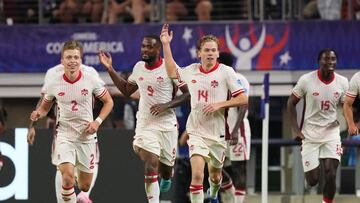 ARLINGTON, TEXAS - JULY 05: Jacob Shaffelburg of Canada celebrates after scoring the team's first goal while holding the jersey #17 of teammate Tajon Buchanan (not in frame) during the CONMEBOL Copa America 2024 quarter-final match between Venezuela and Canada at AT&T Stadium on July 05, 2024 in Arlington, Texas.   Sam Hodde/Getty Images/AFP (Photo by Sam Hodde / GETTY IMAGES NORTH AMERICA / Getty Images via AFP)