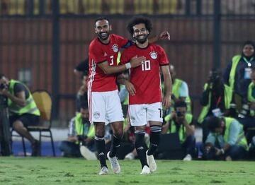 Egypt's Ahmed Elmohamady celebrates with Mohamed Salah after the Liverpool player scored directly from a corner