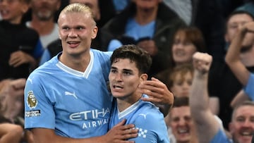 Manchester City's Argentinian striker #19 Julian Alvarez celebrates with Manchester City's Norwegian striker #09 Erling Haaland after scoring the opening goal during the English Premier League football match between Manchester City and Newcastle United at the Etihad Stadium in Manchester, north west England, on August 19, 2023. (Photo by Paul ELLIS / AFP) / RESTRICTED TO EDITORIAL USE. No use with unauthorized audio, video, data, fixture lists, club/league logos or 'live' services. Online in-match use limited to 120 images. An additional 40 images may be used in extra time. No video emulation. Social media in-match use limited to 120 images. An additional 40 images may be used in extra time. No use in betting publications, games or single club/league/player publications. /