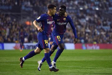 Ousmane Dembele celebrates with his teammate Philippe Coutinho after scoring.