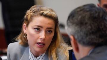 Actor Amber Heard speaks to her legal team as they arrive for closing arguments in the Depp v. Heard trial at the Fairfax County Circuit Courthouse in Fairfax, Virginia, on May 27, 2022. - Actor Johnny Depp is suing ex-wife Amber Heard for libel after she wrote an op-ed piece in The Washington Post in 2018 referring to herself as a public figure representing domestic abuse. (Photo by Steve Helber / POOL / AFP) (Photo by STEVE HELBER/POOL/AFP via Getty Images)