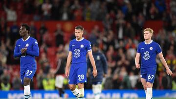Chelsea's Ivorian striker David Fofana (L), Chelsea's Spanish defender Cesar Azpilicueta (C) and Chelsea's English midfielder Lewis Hall (R) react to their defeat on the pitch after the English Premier League football match between Manchester United and Chelsea at Old Trafford in Manchester, north west England, on May 25, 2023. Man Utd won the game 4-1. (Photo by Oli SCARFF / AFP) / RESTRICTED TO EDITORIAL USE. No use with unauthorized audio, video, data, fixture lists, club/league logos or 'live' services. Online in-match use limited to 120 images. An additional 40 images may be used in extra time. No video emulation. Social media in-match use limited to 120 images. An additional 40 images may be used in extra time. No use in betting publications, games or single club/league/player publications. /