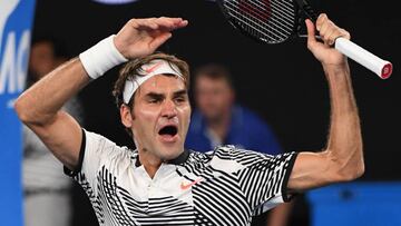Switzerland's Roger Federer celebrates his victory against Japan's Kei Nishikori during their men's singles fourth round match on day seven of the Australian Open tennis tournament in Melbourne on January 22, 2017. / AFP PHOTO / SAEED KHAN / IMAGE RESTRICTED TO EDITORIAL USE - STRICTLY NO COMMERCIAL USE