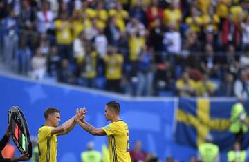 Sweden's defender Emil Krafth replaces Sweden's defender Mikael Lustig (R) during the Russia 2018 World Cup round of 16 football match between Sweden and Switzerland at the Saint Petersburg Stadium in Saint Petersburg on July 3, 2018.