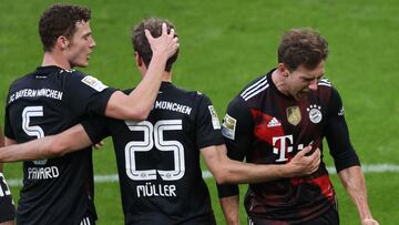 Bayern Munich&#039;s German midfielder Leon Goretzka (R) celebrates scoring the first goal with an assist from Bayern Munich&#039;s German forward Thomas Mueller (C) during the German first divison Bundesliga football match between RB Leipzig and FC Bayer