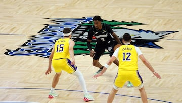 MINNEAPOLIS, MINNESOTA - OCTOBER 29: Jaden McDaniels #3 of the Minnesota Timberwolves dribbles the ball against Austin Reaves #15 and Jake LaRavia #12 of the Los Angeles Lakers in the first quarter at Target Center on October 29, 2025 in Minneapolis, Minnesota. NOTE TO USER: User expressly acknowledges and agrees that, by downloading and or using this photograph, User is consenting to the terms and conditions of the Getty Images License Agreement. David Berding/Getty Images/AFP (Photo by David Berding / GETTY IMAGES NORTH AMERICA / Getty Images via AFP)