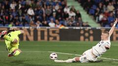 Getafe's Spanish goalkeeper #13 David Soria dives to stop an attempt on goal by Girona's Ukrainian forward #09 Artem Dovbyk during the Spanish league football match between Getafe CF and Girona FC at the Col. Alfonso Perez stadium in Getafe on March 16, 2024. (Photo by Thomas COEX / AFP)