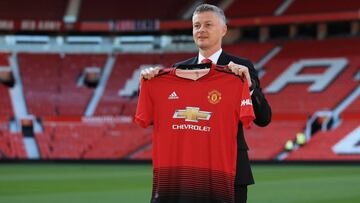 Soccer Football - Manchester United manager Ole Gunnar Solskjaer Press Conference - Old Trafford, Manchester, Britain - March 28, 2019   Manchester United manager Ole Gunnar Solskjaer poses with a shirt on the pitch   REUTERS/Jon Super