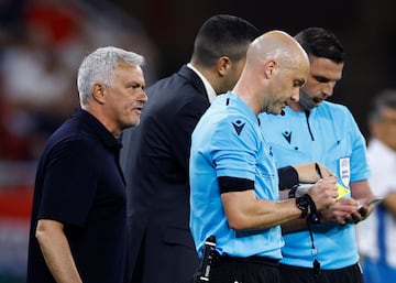 AS Roma coach Jose Mourinho remonstrates with referee Anthony Taylor after losing the final   