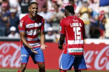 El Arabi (Granada CF) y Lass (Granada CF) celebran el 2-0