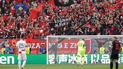 Supporters of Albania hold a sign reading "Kosovo is Albania" during the UEFA Euro 2024 Group B football match between Croatia and Albania at the Volksparkstadion in Hamburg on June 19, 2024. (Photo by Odd ANDERSEN / AFP)