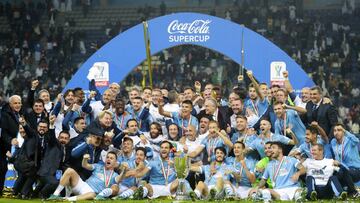 Lazio players celebrate after winning the Italian Super Cup against Juventus at King Saud University Stadium, in Riyadh, Saudi Arabia, Sunday, Dec. 22, 2019. (AP Photo/Nasser Alharbi)