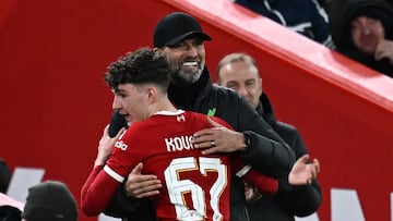 Liverpool's German manager Jurgen Klopp (R) congratulates Liverpool's English striker #67 Lewis Koumas (L) as he leaves the game, substituted during the English FA Cup fifth round football match between Liverpool and Southampton at Anfield stadium, in Liverpool, north west England, on February 28, 2024. (Photo by Paul ELLIS / AFP) / RESTRICTED TO EDITORIAL USE. No use with unauthorized audio, video, data, fixture lists, club/league logos or 'live' services. Online in-match use limited to 120 images. An additional 40 images may be used in extra time. No video emulation. Social media in-match use limited to 120 images. An additional 40 images may be used in extra time. No use in betting publications, games or single club/league/player publications. / 