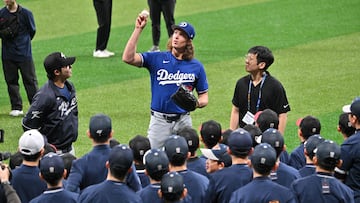 Los Angeles Dodgers' starting pitcher Tyler Glasnow (C) participates in a skills clinic with local youth players during a baseball workout at Gocheok Sky Dome in Seoul on March 16, 2024, ahead of the 2024 MLB Seoul Series baseball game between Los Angeles Dodgers and San Diego Padres. (Photo by Jung Yeon-je / AFP)