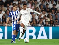 Real Madrid's English midfielder #05 Jude Bellingham fights for the ball with Alaves' Spanish midfielder #04 Denis Suarez during the Spanish league football match between Real Madrid CF and Deportivo Alaves at the Santiago Bernabeu stadium in Madrid on April 21, 2026. (Photo by Pierre-Philippe MARCOU / AFP)