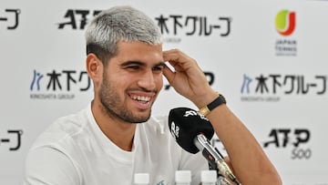 Spain's Carlos Alcaraz speaks to the media during a press conference on the sidelines of the men's ATP Japan Open tennis tournament in Tokyo on September 24, 2025. (Photo by Richard A. Brooks / AFP)