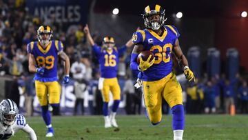 LOS ANGELES, CA - JANUARY 12: Todd Gurley #30 of the Los Angeles Rams runs for a 35 yard touchdown in the second quarter against the Dallas Cowboys in the NFC Divisional Playoff game at Los Angeles Memorial Coliseum on January 12, 2019 in Los Angeles, Cal