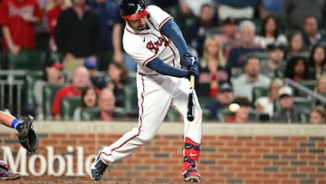 ATLANTA, GA - OCTOBER 2: Travis d'Arnaud #16 of the Atlanta Braves hits a two-run RBI against the New York Mets during the third inning at Truist Park on October 2, 2022 in Atlanta, Georgia. Adam Hagy/Getty Images/AFP