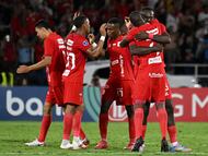 America de Cali's players celebrate after winning the Copa Sudamericana knockout round play-off football match between Colombia's America de Cali and Brazil's Bahia at the Olimpico Pascual Guerrero Stadium in Cali, Colombia, on July 22, 2025. (Photo by Joaqu�n SARMIENTO / AFP)