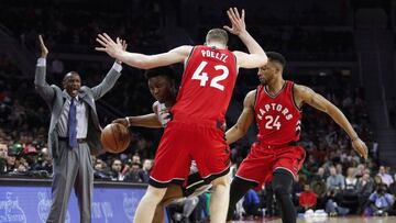 Mar 17, 2017; Auburn Hills, MI, USA; Detroit Pistons forward Stanley Johnson (7) is defended by Toronto Raptors center Jakob Poeltl (42) and guard Norman Powell (24) as head coach Dwane Casey reacts at left during the fourth quarter at The Palace of Auburn Hills. Raptors win 87-75. Mandatory Credit: Raj Mehta-USA TODAY Sports
