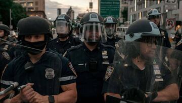 NEW YORK, NY - JUNE 02: NYPD officers block the entrance of the Manhattan Bridge as hundreds protesting police brutality and systemic racism attempt to cross into the borough of Manhattan from Brooklyn after a citywide curfew went into effect in New York 