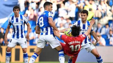 Getafe's Turkish forward Enes Unal vies with Real Sociedad's Spanish midfielder Ander Guevara (R) and Real Sociedad's Spanish midfielder Mikel Merino (2L) during the Spanish league football match between Real Sociedad and Getafe CF at the Reale Arena stadium in San Sebastian on April 8, 2023. (Photo by ANDER GILLENEA / AFP) (Photo by ANDER GILLENEA/AFP via Getty Images)