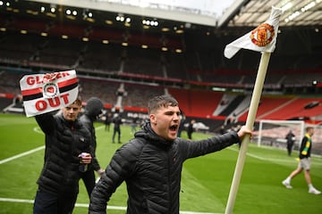 Supporters protest against Manchester United's owners, inside their Old Trafford stadium.