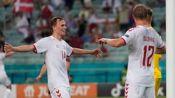 Denmark&#039;s forward Kasper Dolberg (R) celebrates with Denmark&#039;s forward Mikkel Damsgaard (C) after scoring his team&#039;s second goal during the UEFA EURO 2020 quarter-final football match between the Czech Republic and Denmark at the Olympic St