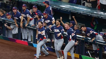 MIAMI, FLORIDA - MARCH 15: Members of Team United States react after the home run hit by Gunnar Henderson #11 (not pictured) against Team Dominican Republic during the fourth inning at loanDepot park on March 15, 2026 in Miami, Florida. Megan Briggs/Getty Images/AFP (Photo by Megan Briggs / GETTY IMAGES NORTH AMERICA / Getty Images via AFP)