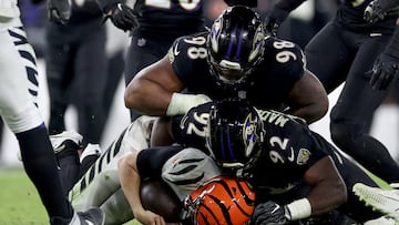 BALTIMORE, MARYLAND - NOVEMBER 16: Justin Madubuike #92 of the Baltimore Ravens sacks Jake Browning #6 of the Cincinnati Bengals during the fourth quarter of the game at M&T Bank Stadium on November 16, 2023 in Baltimore, Maryland.   Patrick Smith/Getty Images/AFP (Photo by Patrick Smith / GETTY IMAGES NORTH AMERICA / Getty Images via AFP)