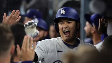 Los Angeles (United States), 21/09/2024.- Los Angeles Dodgers' Shohei Ohtani high-fives teammates after hitting a home run during the fifth inning of the Major League Baseball (MLB) game between the Colorado Rockies and the Los Angeles Dodgers in Los Angeles, California, USA, 20 September 2024. EFE/EPA/ALLISON DINNER