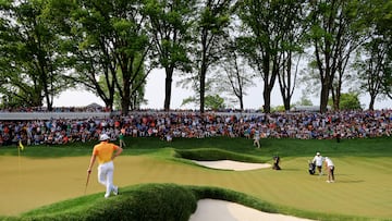 May 21, 2023; Rochester, New York, USA; Viktor Hovland (left) watches as Brooks Koepka putts on the 13th green during the final round of the PGA Championship golf tournament at Oak Hill Country Club. Mandatory Credit: Aaron Doster-USA TODAY Sports