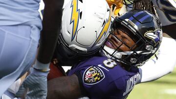 Jan 6, 2019; Baltimore, MD, USA; Baltimore Ravens quarterback Lamar Jackson (8) is tackled by Los Angeles Chargers defensive end Joey Bosa (99) in the first quarter in a AFC Wild Card playoff football game at M&amp;T Bank Stadium. Mandatory Credit: Geoff 