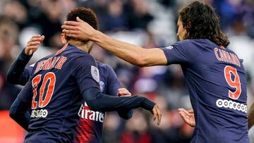 Paris Saint-Germain's Brazilian forward Neymar (L) celebrates after scoring a goal with Paris Saint-Germain's Italian midfielder Marco Verratti (unseen) and Paris Saint-Germain's Uruguayan forward Edinson Cavani (R) during the French L1 foo