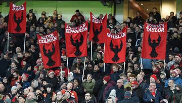 Manchester United fans hold up banners showing the names of former Manchester United players who died in the 1958 Munich Air Disaster ahead of the English Premier League football match between Manchester United and Burnley at Old Trafford in Manchester, n