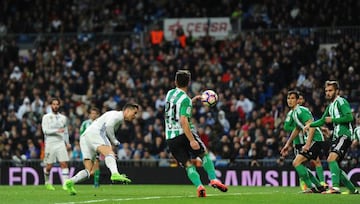 MADRID, SPAIN - MARCH 12: Cristiano Ronaldo of Real Madrid scores Real's opening goal during the La Liga match between Real Madrid CF and Real Betis Balompie at Estadio Santiago Bernabeu on March 12, 2017 in Madrid, Spain.