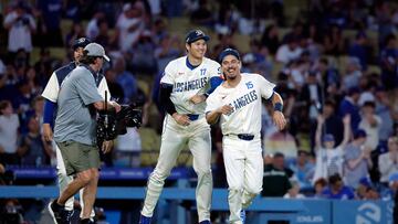 LOS ANGELES, CALIFORNIA - JUNE 22: Shohei Ohtani #17 of the Los Angeles Dodgers and catcher Austin Barnes #15 joke around after defeating the Los Angeles Angels, 7-2, at Dodger Stadium on June 22, 2024 in Los Angeles, California. Kevork Djansezian/Getty Images/AFP (Photo by KEVORK DJANSEZIAN / GETTY IMAGES NORTH AMERICA / Getty Images via AFP)