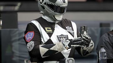 A Las Vegas Raiders fan takes a photo