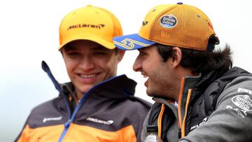 SHANGHAI, CHINA - APRIL 14: Lando Norris of Great Britain and McLaren F1 talks with Carlos Sainz of Spain and McLaren F1 before the F1 Grand Prix of China at Shanghai International Circuit on April 14, 2019 in Shanghai, China. (Photo by Charles Coates/Getty Images)