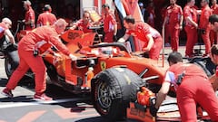 Technicians move the car of Ferrari&#039;s German driver Sebastian Vettel in the pits during the third practice session at the Circuit Paul Ricard in Le Castellet, southern France, on June 22, 2019, ahead of the Formula One Grand Prix de France. (Photo by Boris HORVAT / AFP)