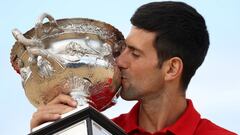 FILE PHOTO: Tennis - Australian Open - Men's Singles Photo Shoot - Brighton Beach, Melbourne, Australia, February 22, 2021 Australian Open champion Serbia's Novak Djokovic poses with the trophy during a photo shoot at Brighton Beach REUTERS/Loren Elliott/