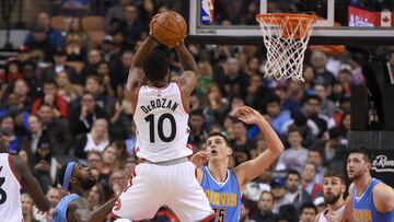 Oct 31, 2016; Toronto, Ontario, CAN;  Toronto Raptors guard DeMar DeRozan (10) takes a jump shot over Denver Nuggets center Nikola Jokic (15) and guard Will Barton (5) in the first half at Air Canada Centre. Mandatory Credit: Dan Hamilton-USA TODAY 