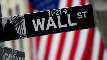 FILE PHOTO: A Wall Street sign outside the New York Stock Exchange in New York City, New York, U.S., October 2, 2020. REUTERS/Carlo Allegri//File Photo