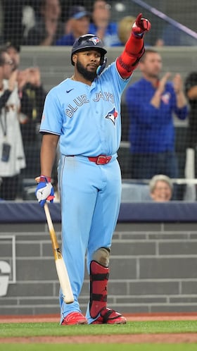 Apr 8, 2026; Toronto, Ontario, CAN; Toronto Blue Jays first baseman Vladimir Guerrero Jr. (27) gestures to a team mate before an at bat against the Los Angeles Dodgers during the seventh inning at Rogers Centre. Mandatory Credit: John E. Sokolowski-Imagn Images